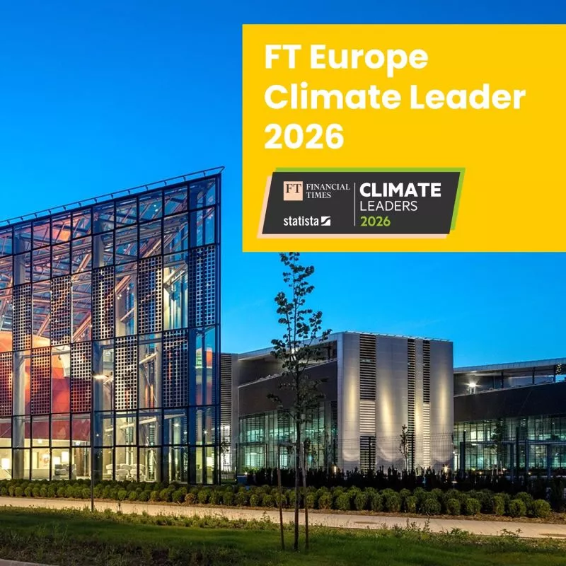 Modern glass building at dusk with FT Europe Climate Leader 2026 logo.